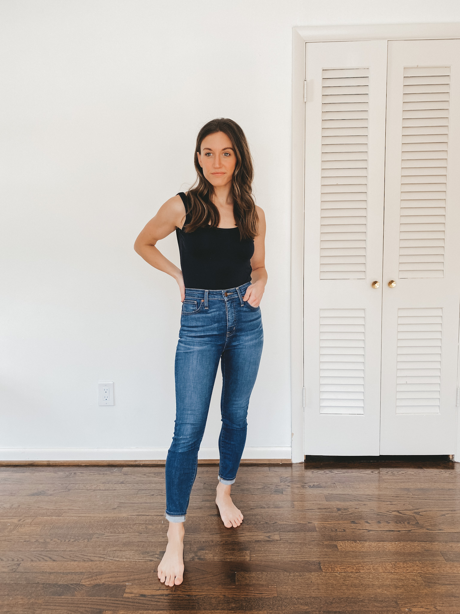 ashley wearing skinny mid-wash jeans from Madewell
