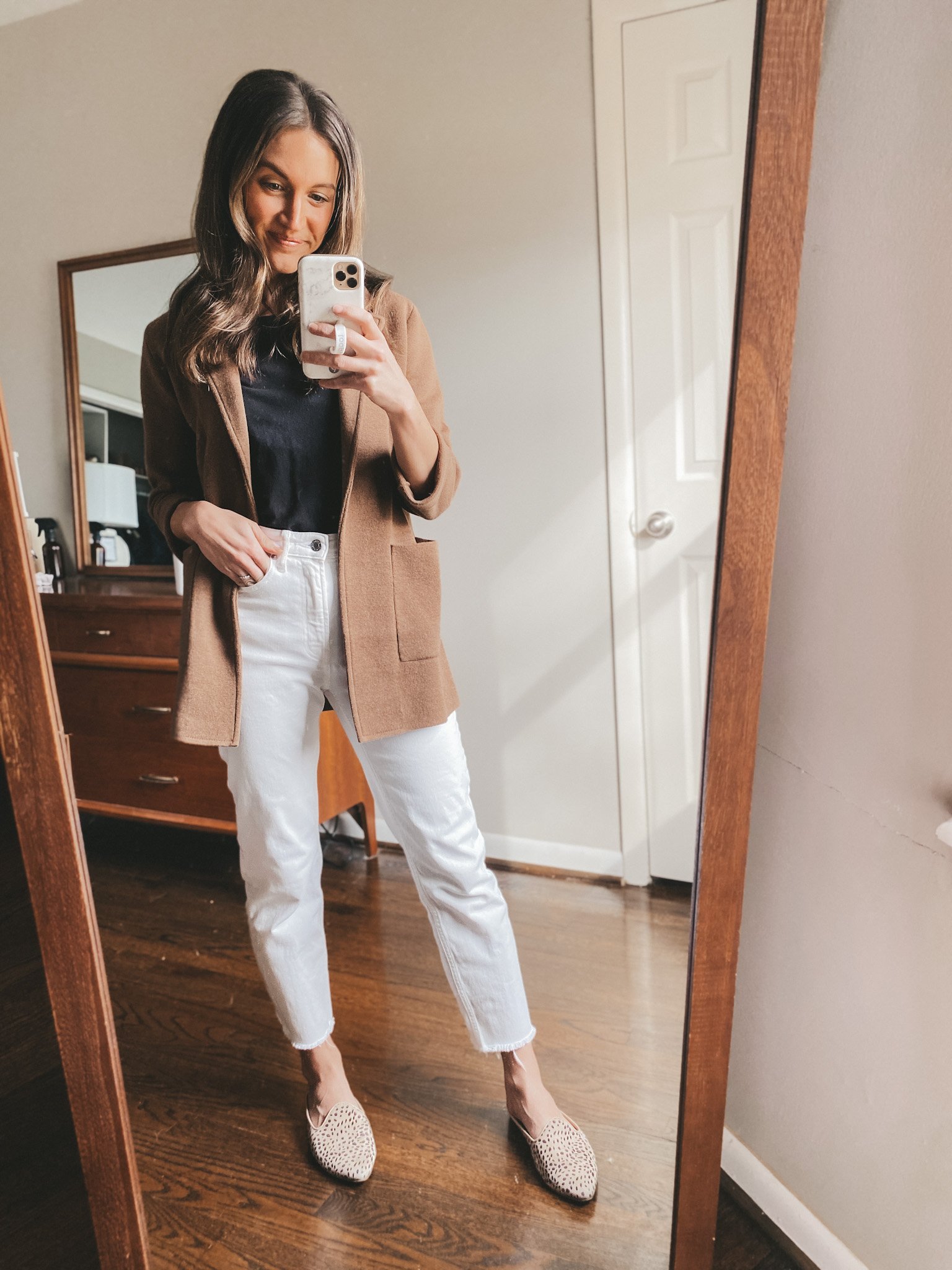 ashley wearing an Everlane black bodysuit, a J.Crew brown sweater blazer, Everlane straight leg jeans, and Target Leopard Mules