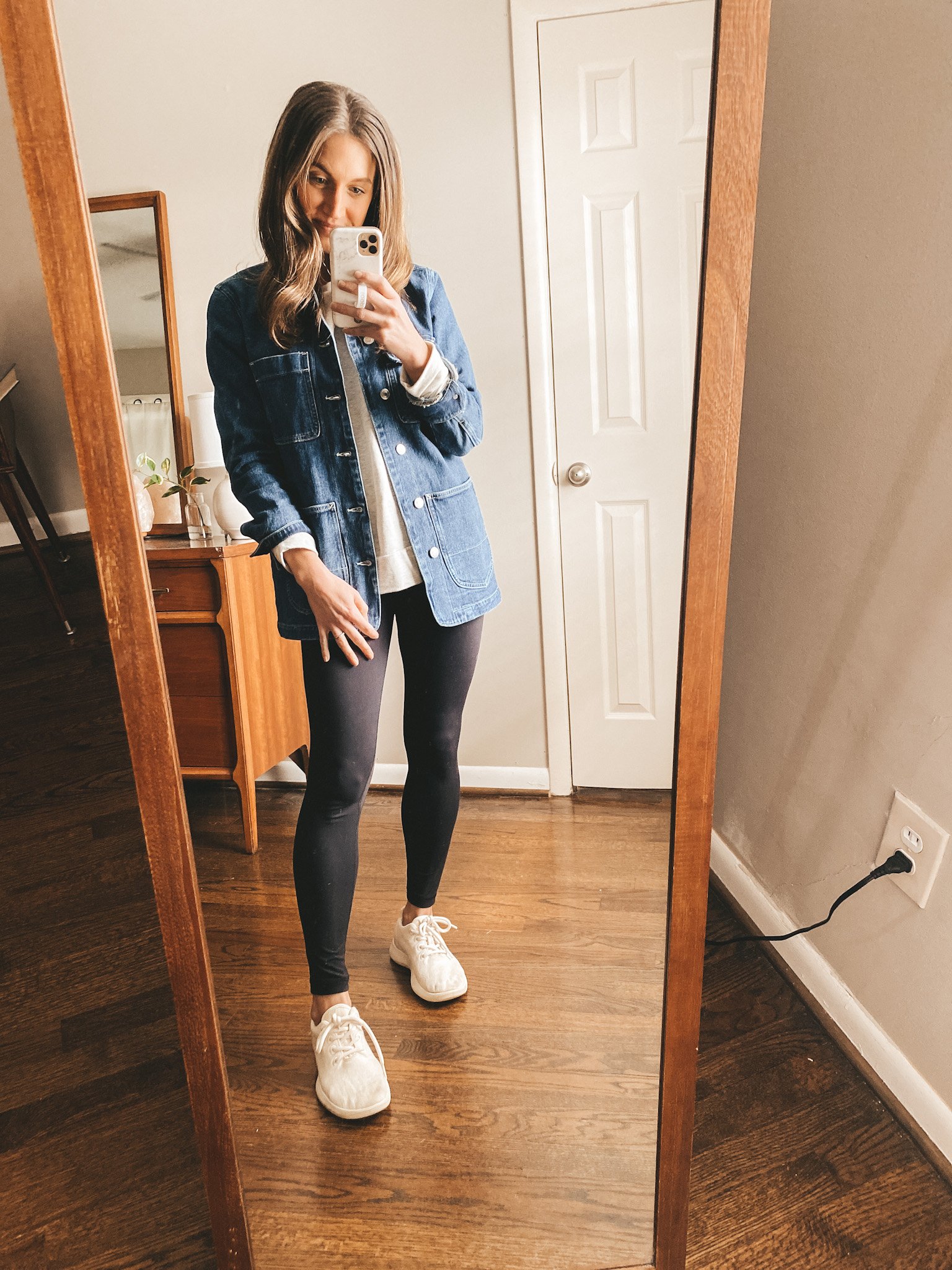 ashley wearing a denim jacket from Walmart, heather gray sweatshirt from Aerie, CRZ Yoga leggings, and Allbirds wool runners