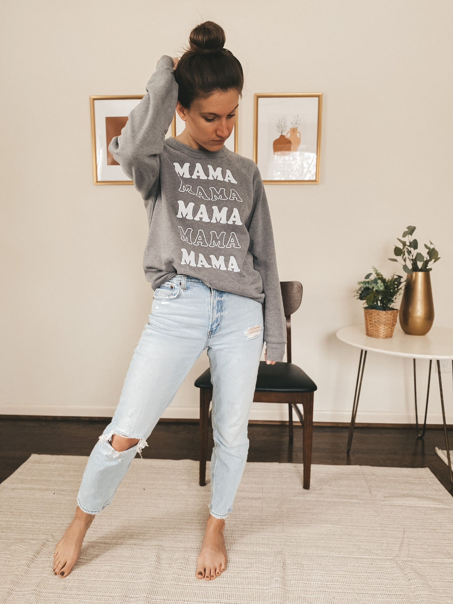 ashley wearing distressed light wash jeans from Abercrombie and a great sweatshirt that says MAMA