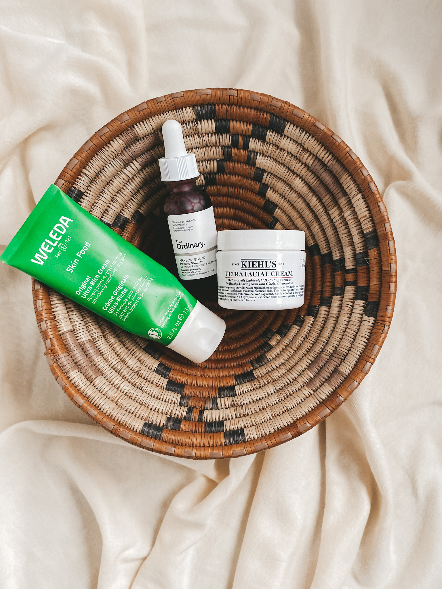 brown woven basket with welda skin food, the ordinary peeling solution and kiehl