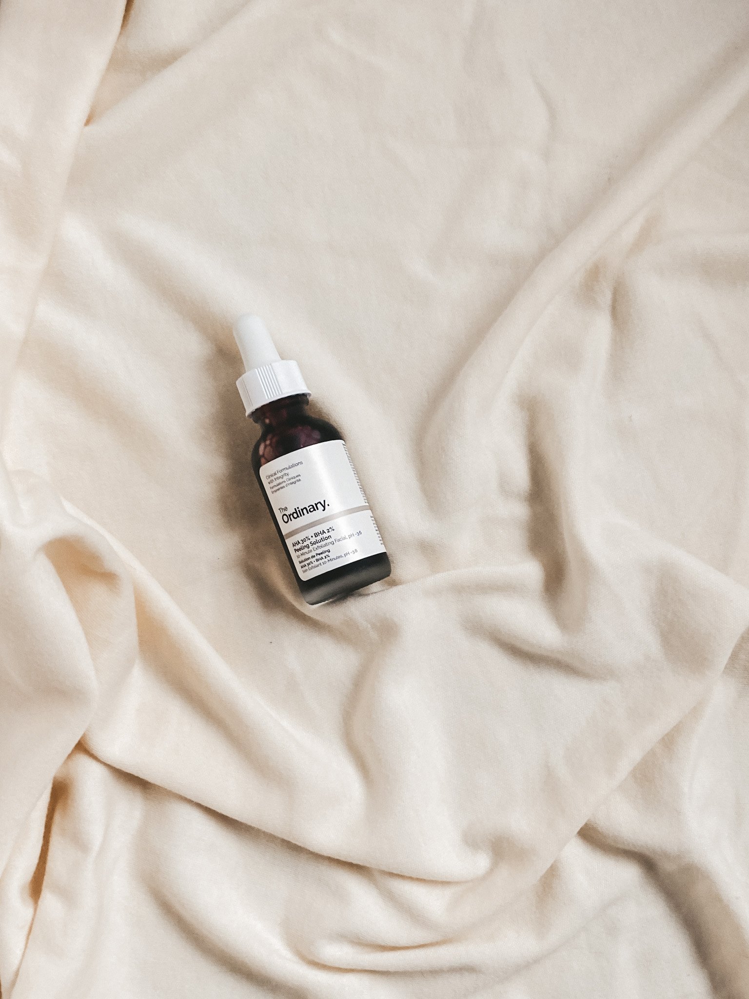 picture of The Ordinary AHA and BHA Peeling Solution on a cream fabric background