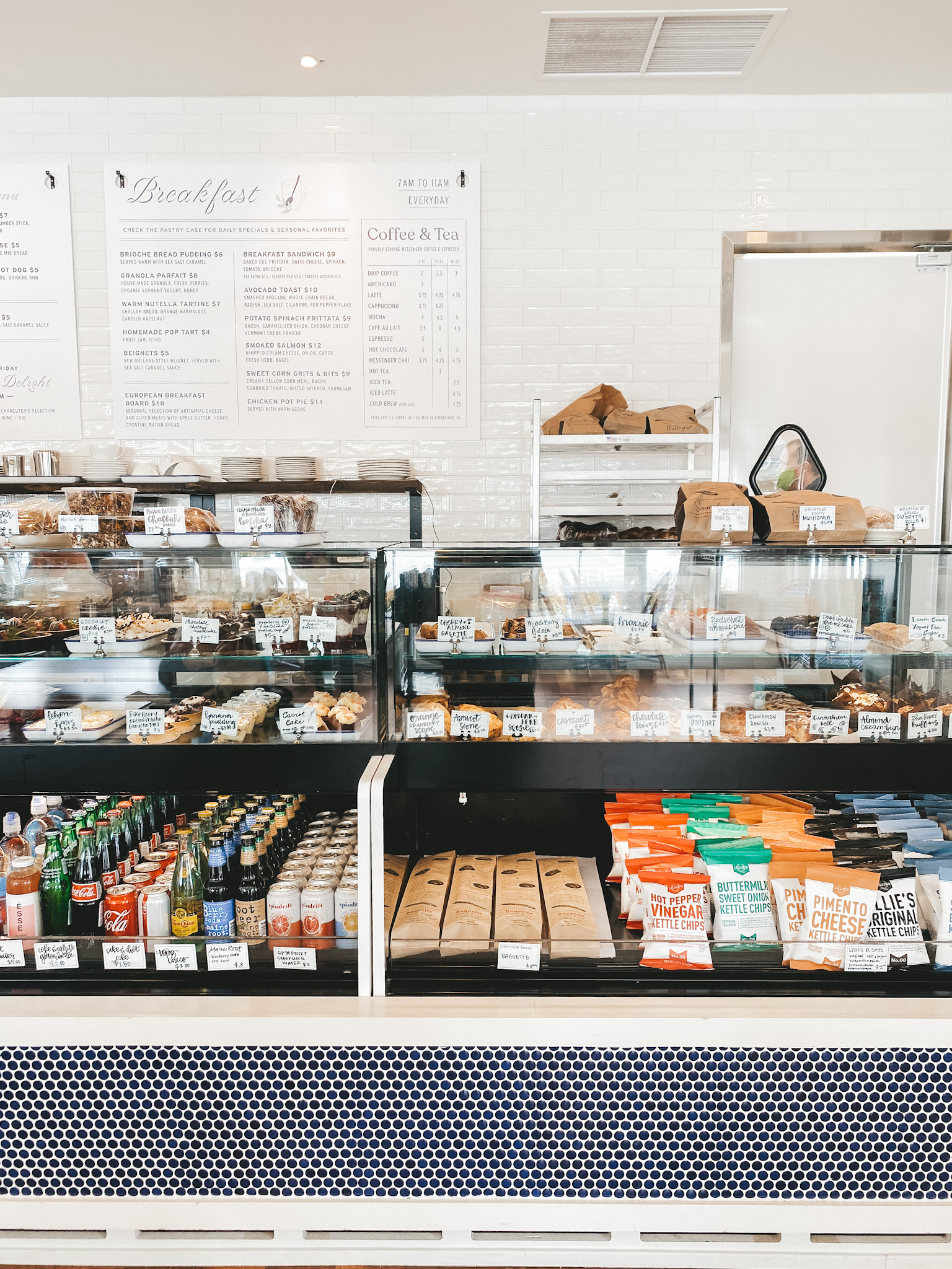 a picture of the Market at Meadowbrook, a display of pastries, beverages and desserts