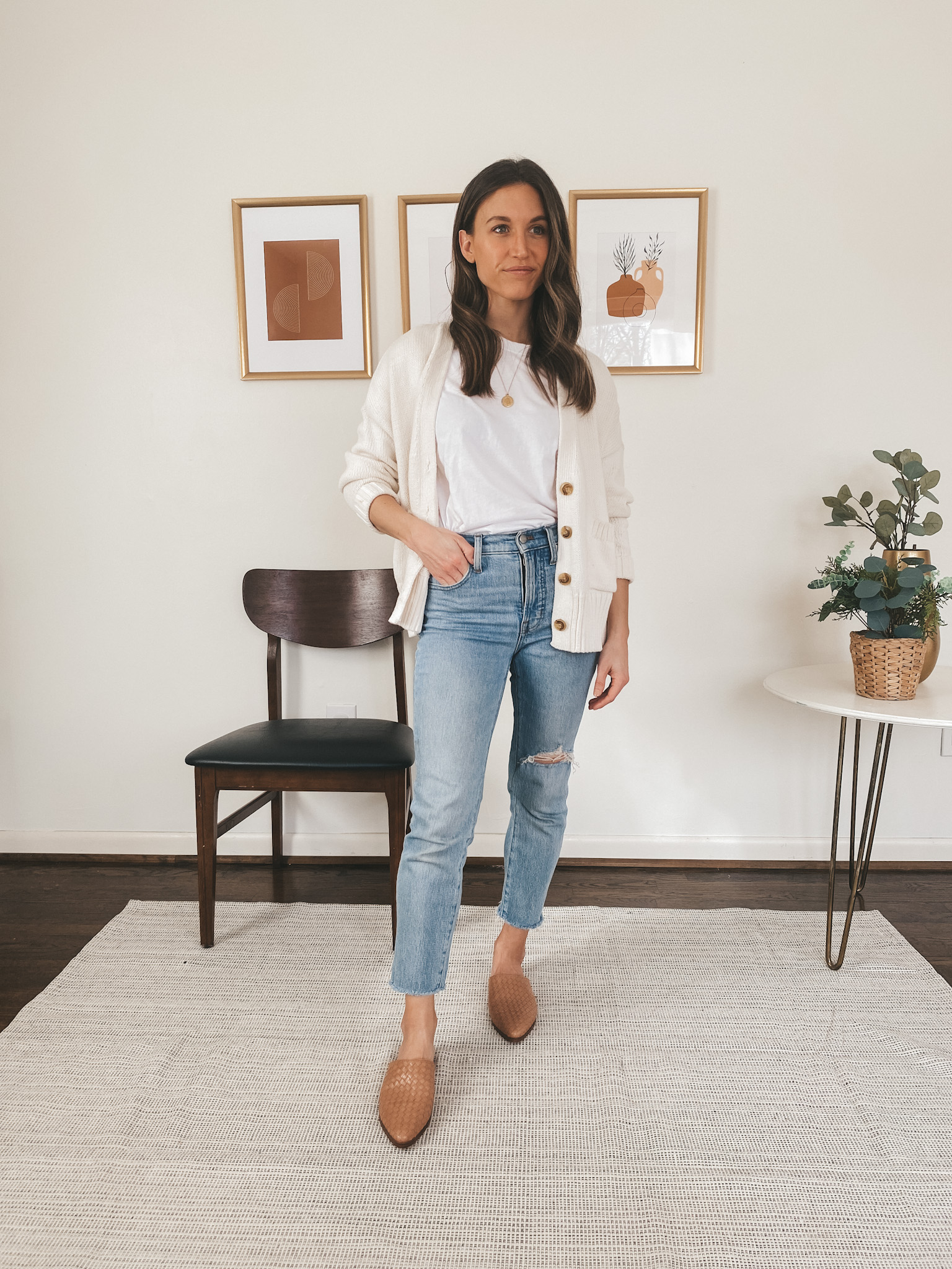 ashley wearing an Everlane white tee, a Target cream colored button front cardigan, Madewell Perfect Vintage Jeans, and Marc Fisher woven mules