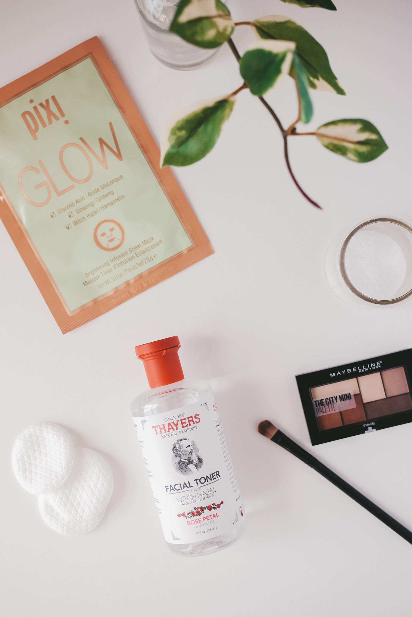 a white background with a Pixi Glow sheet mask, Thayer
