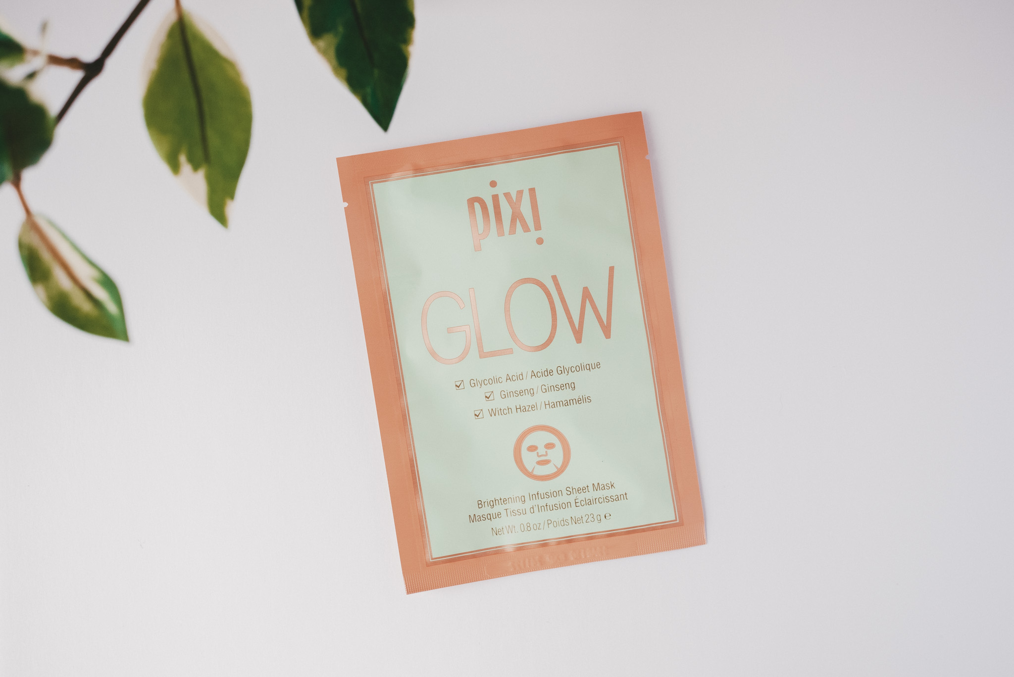 a white background with Pixi Glow Brightening Face Mask