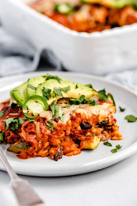 enchilada casserole on a gray rimmed plate