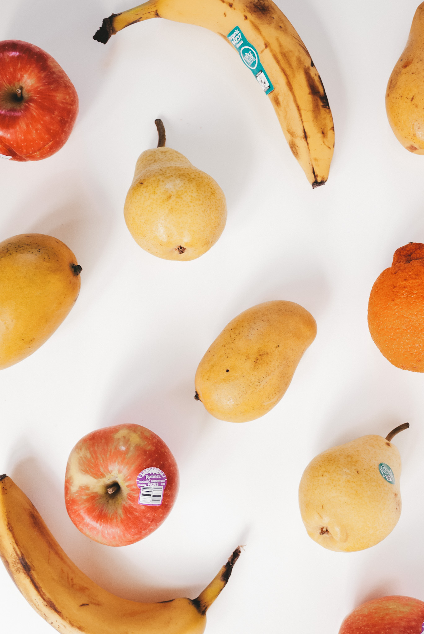 an assortment of fruit on a white background