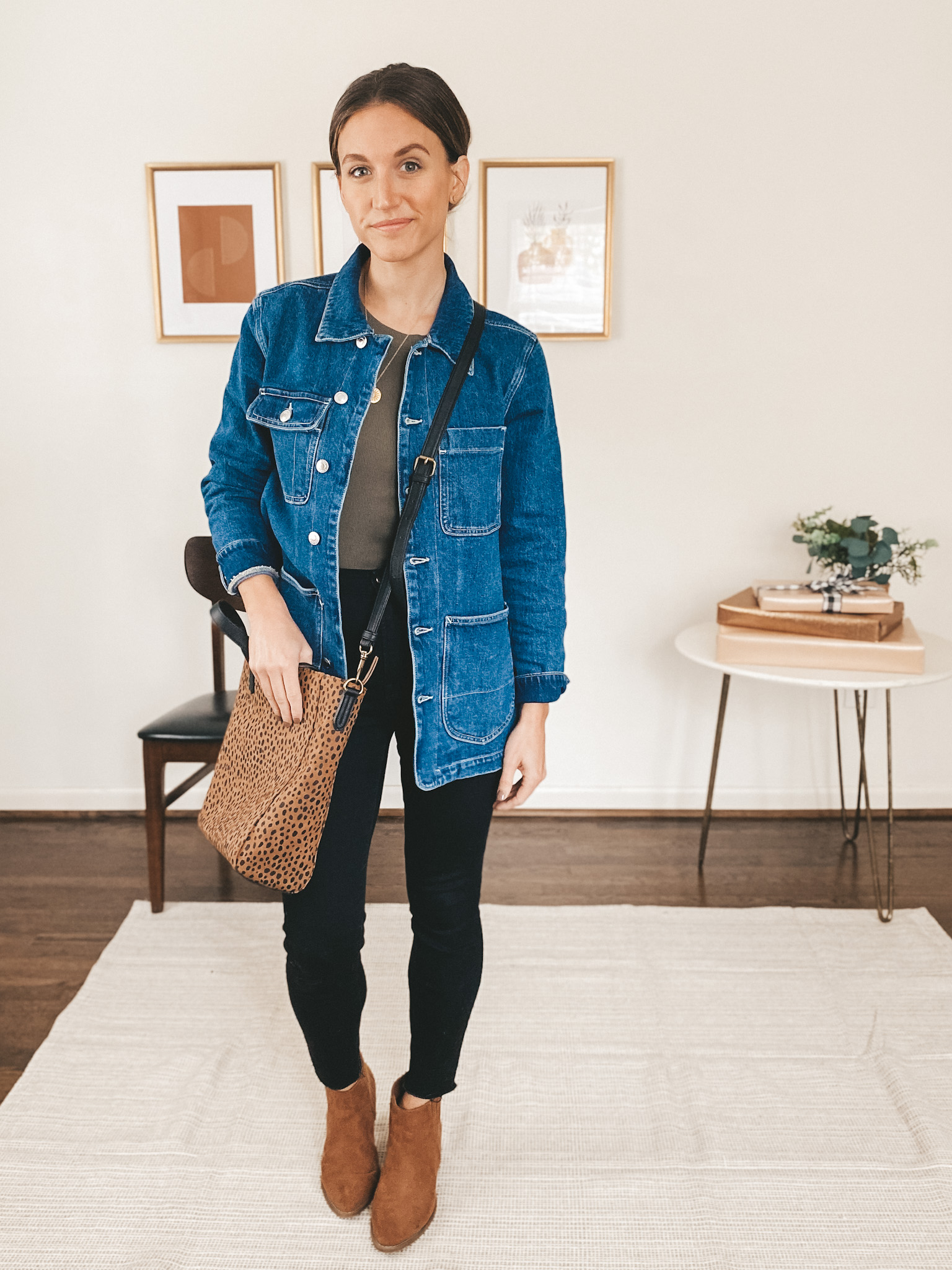 ashley wearing the Walmart Free Assembly Denim Barn Jacket with an olive green tee, black skinny jeans, brown ankle boots and a leopard print crossbody bag
