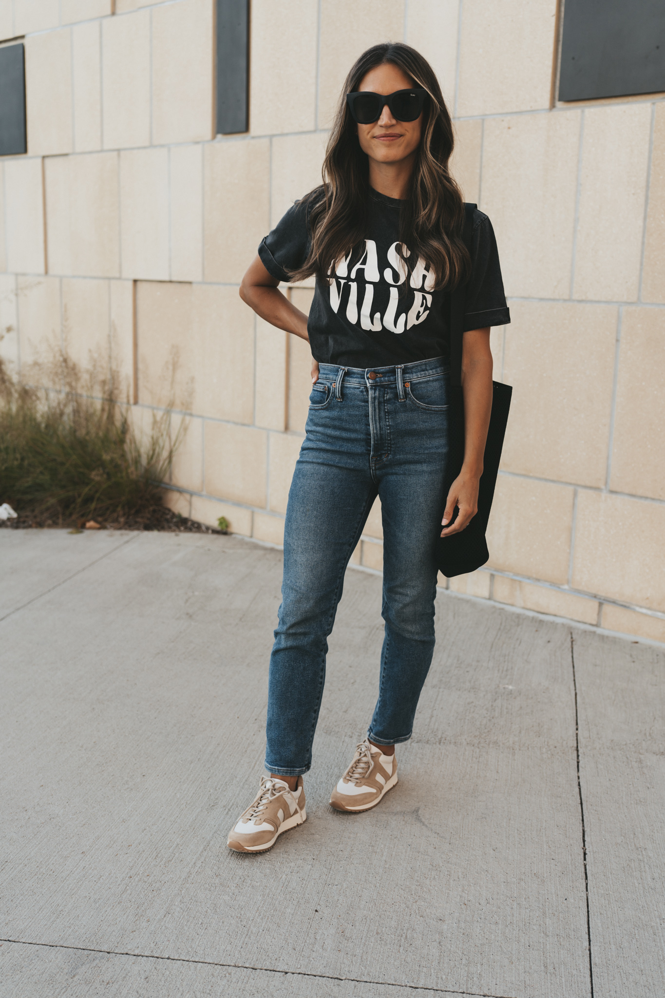 ashley wearing a black graphic tee that reads