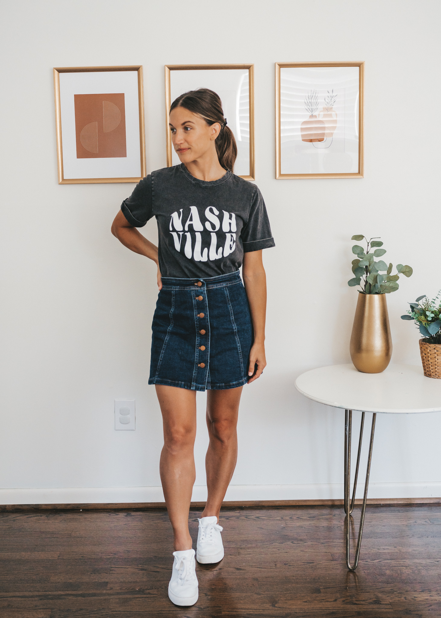 ashley wearing a washed black tee that reads 