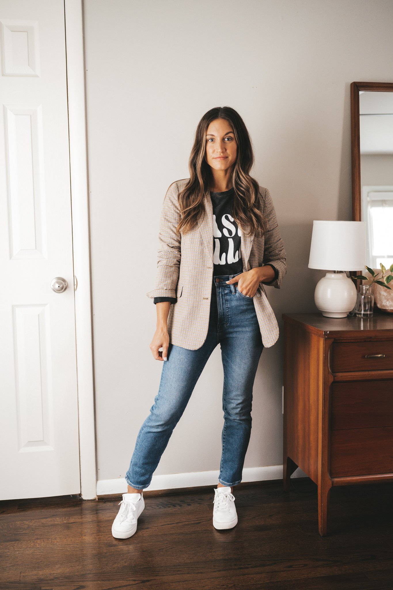 ashley wearing a washed black graphic tee that reads 