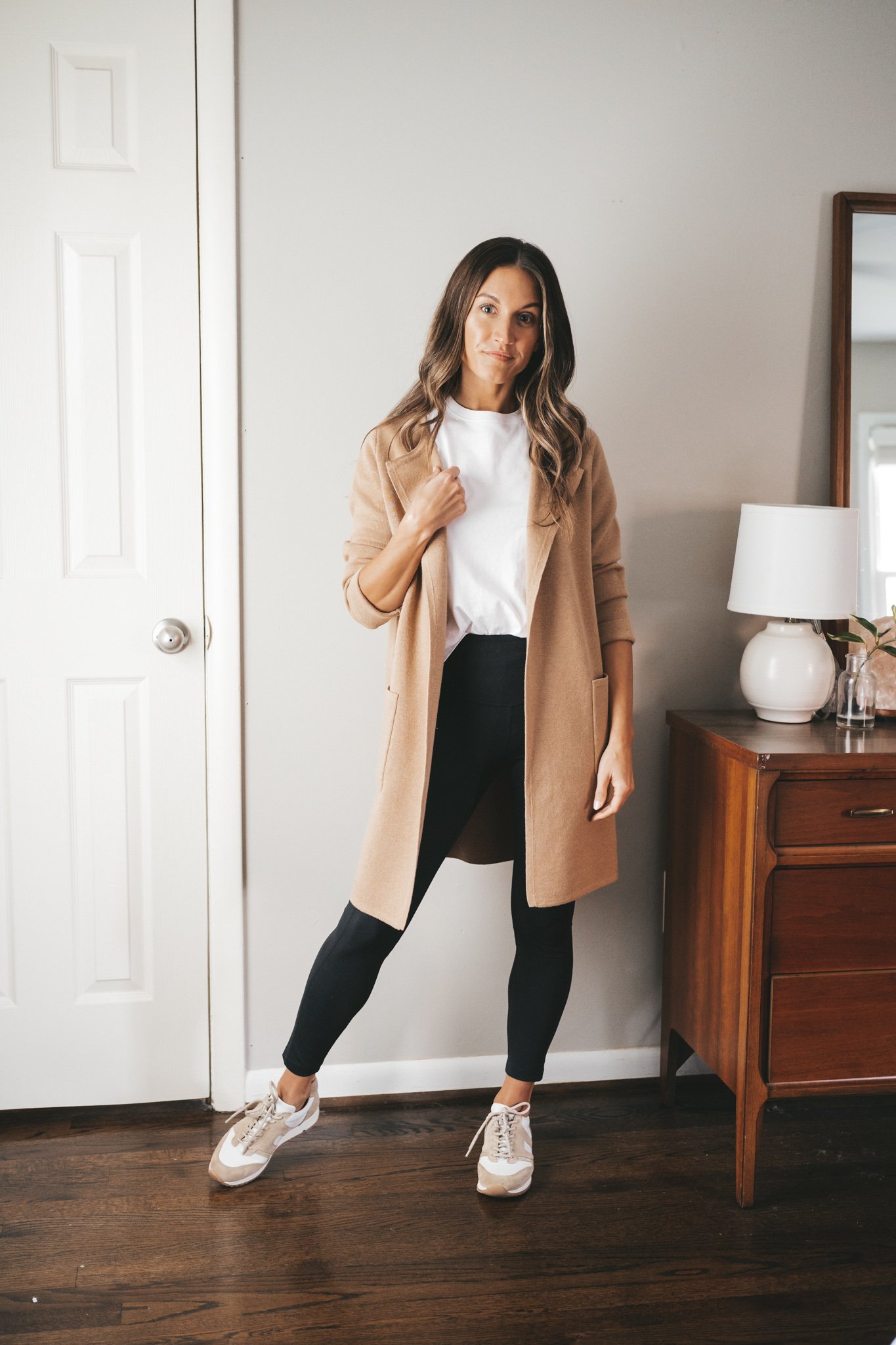 ashley wearing a white tee under a J.Crew Juliette Sweater Blazer, black leggings, and white sneakers