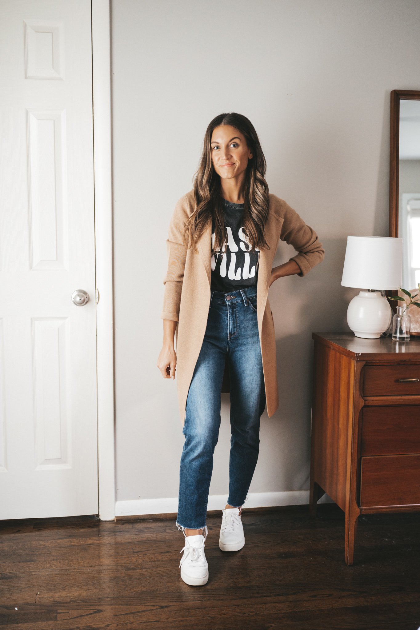 ashley wearing a washed black graphic tee that reads