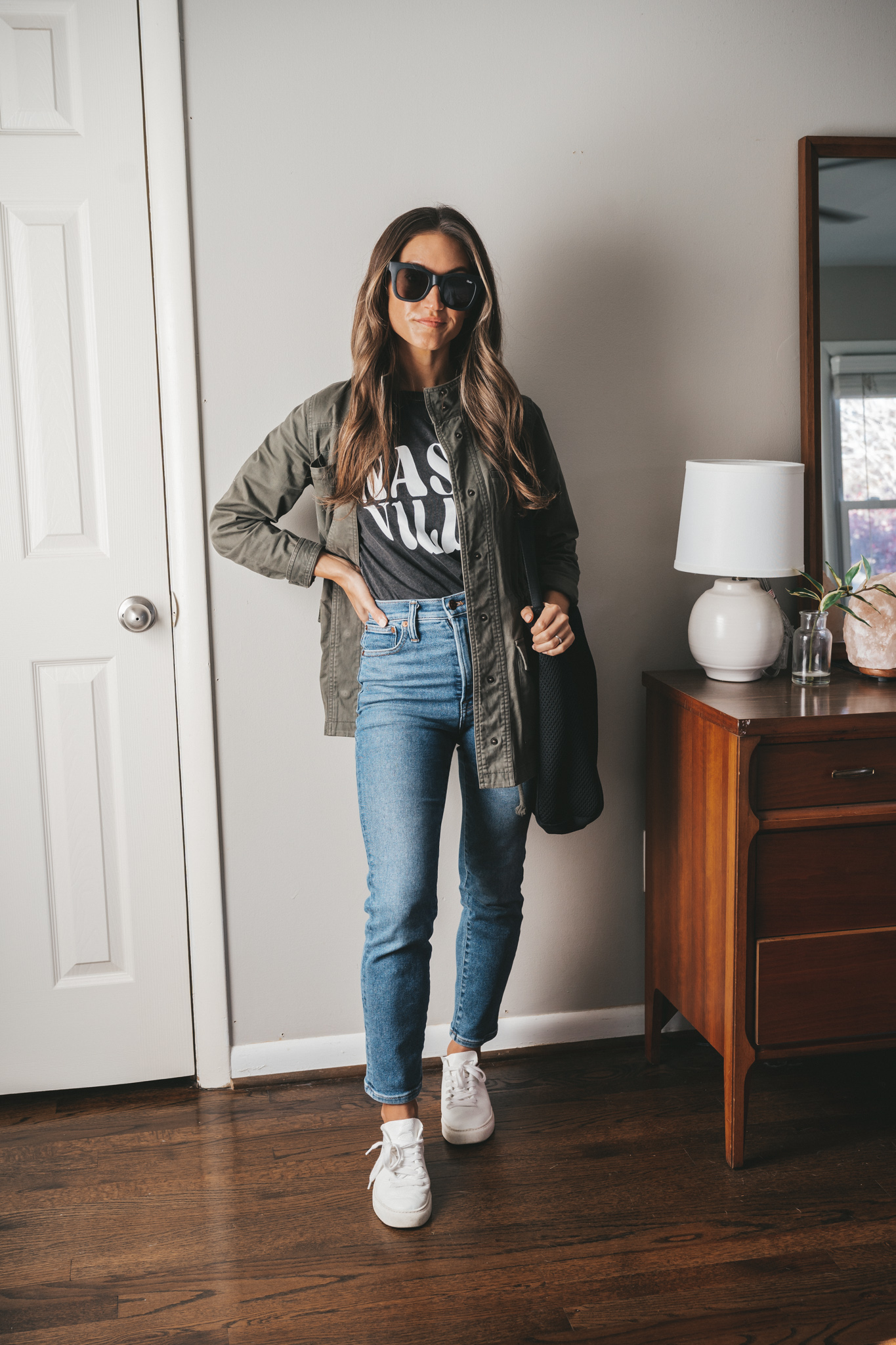 ashley wearing a black graphic tee that reads 
