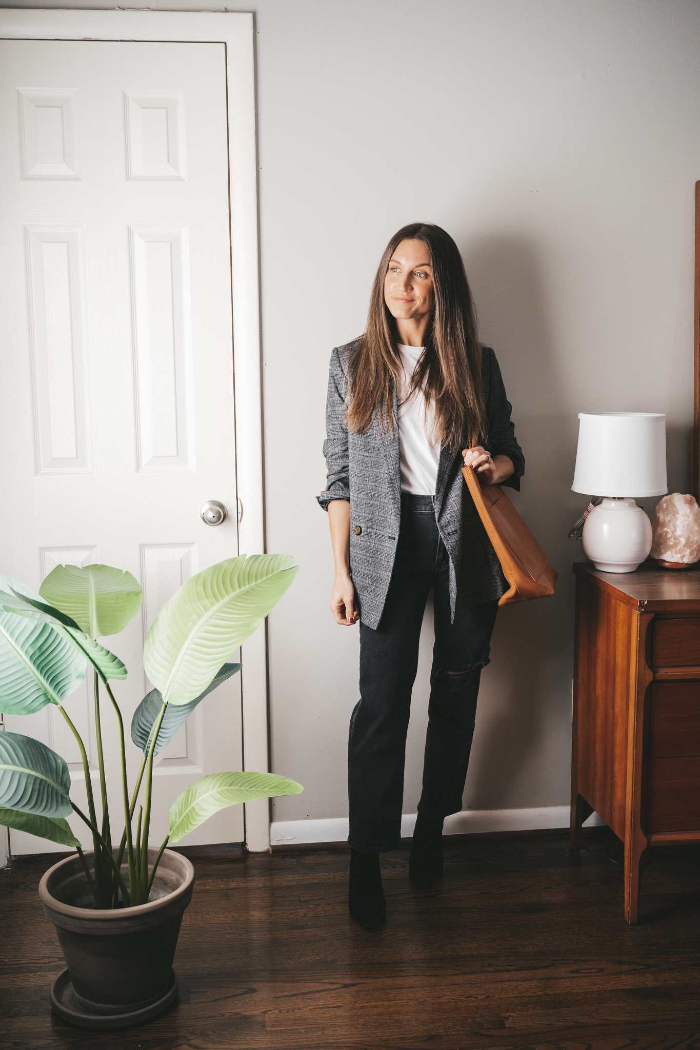 winter essential plaid blazer worn with a white tee, black denim, black ankle boots and cognac tote bag