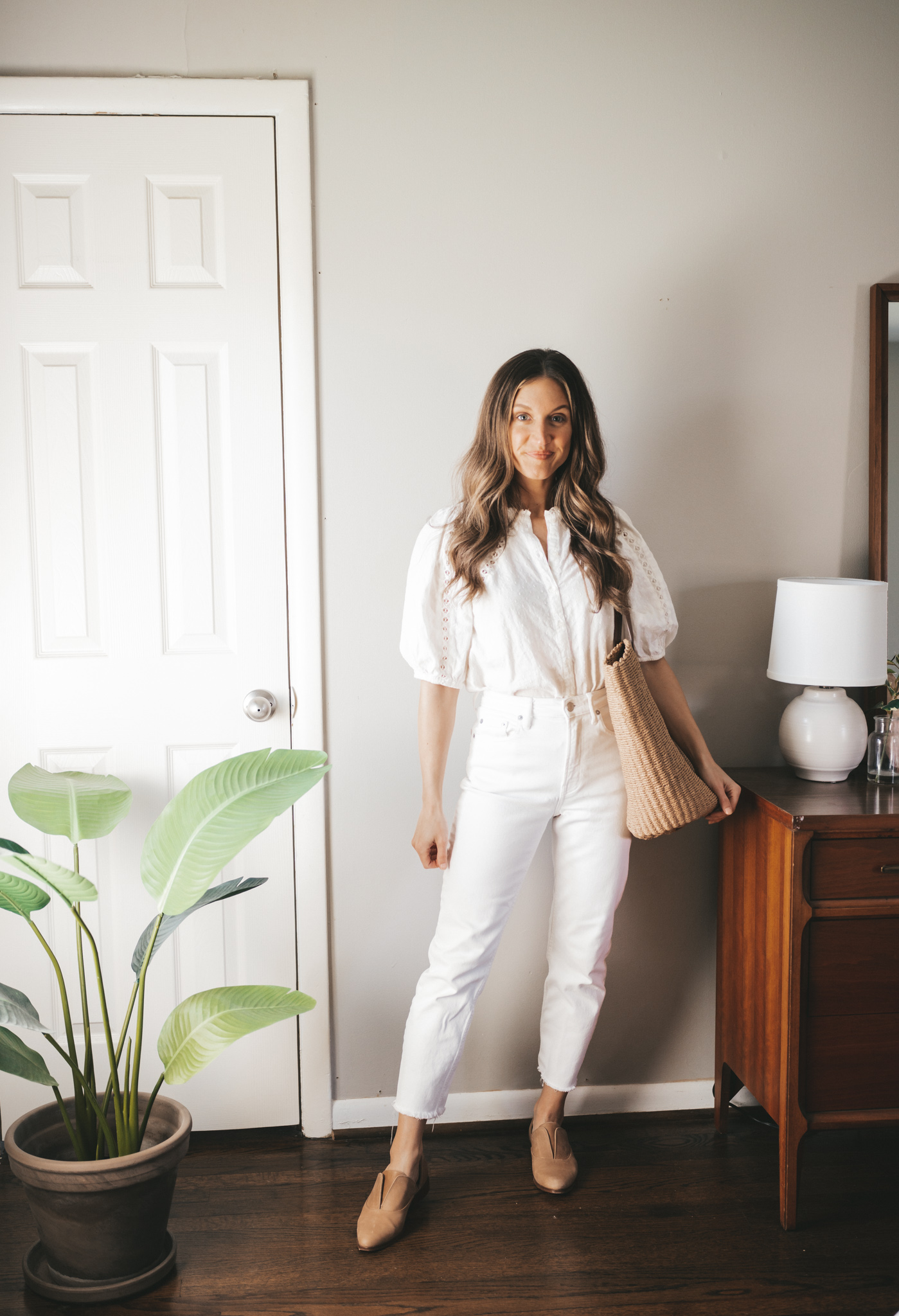white denim outfit idea with a white blouse, white denim, nude oxfords, and a straw bag