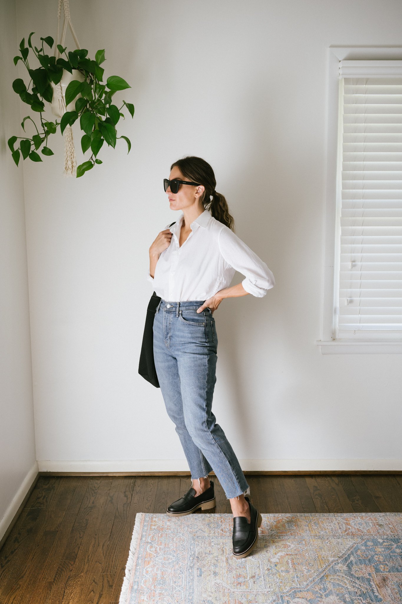 a white button down outfit with denim and loafers