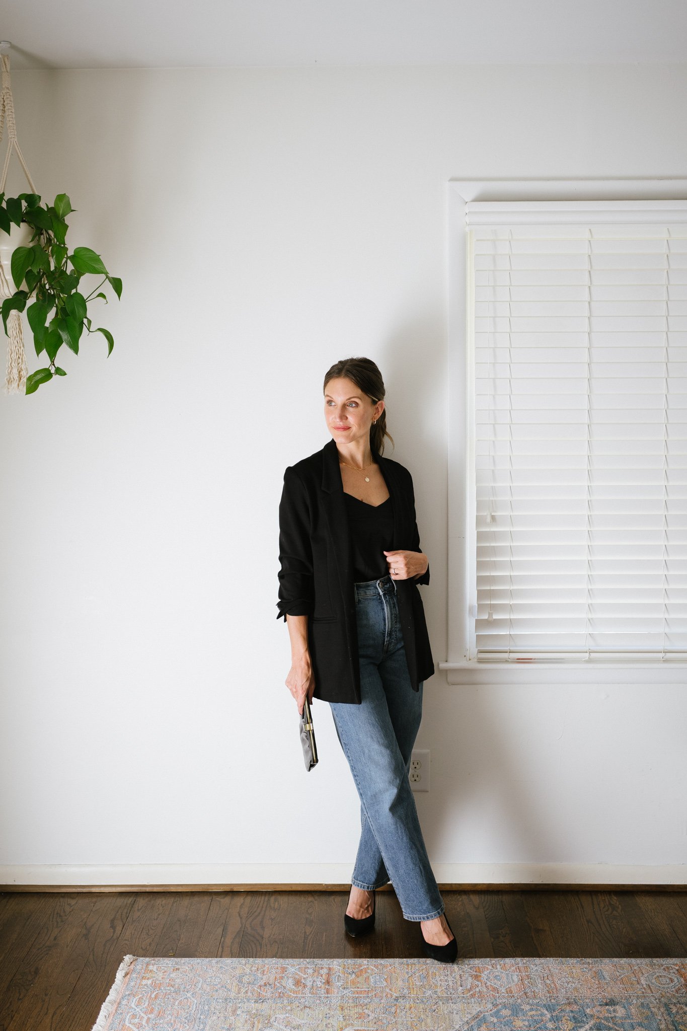 fall date night outfit with a silk cami, black blazer, straight denim, and black pumps