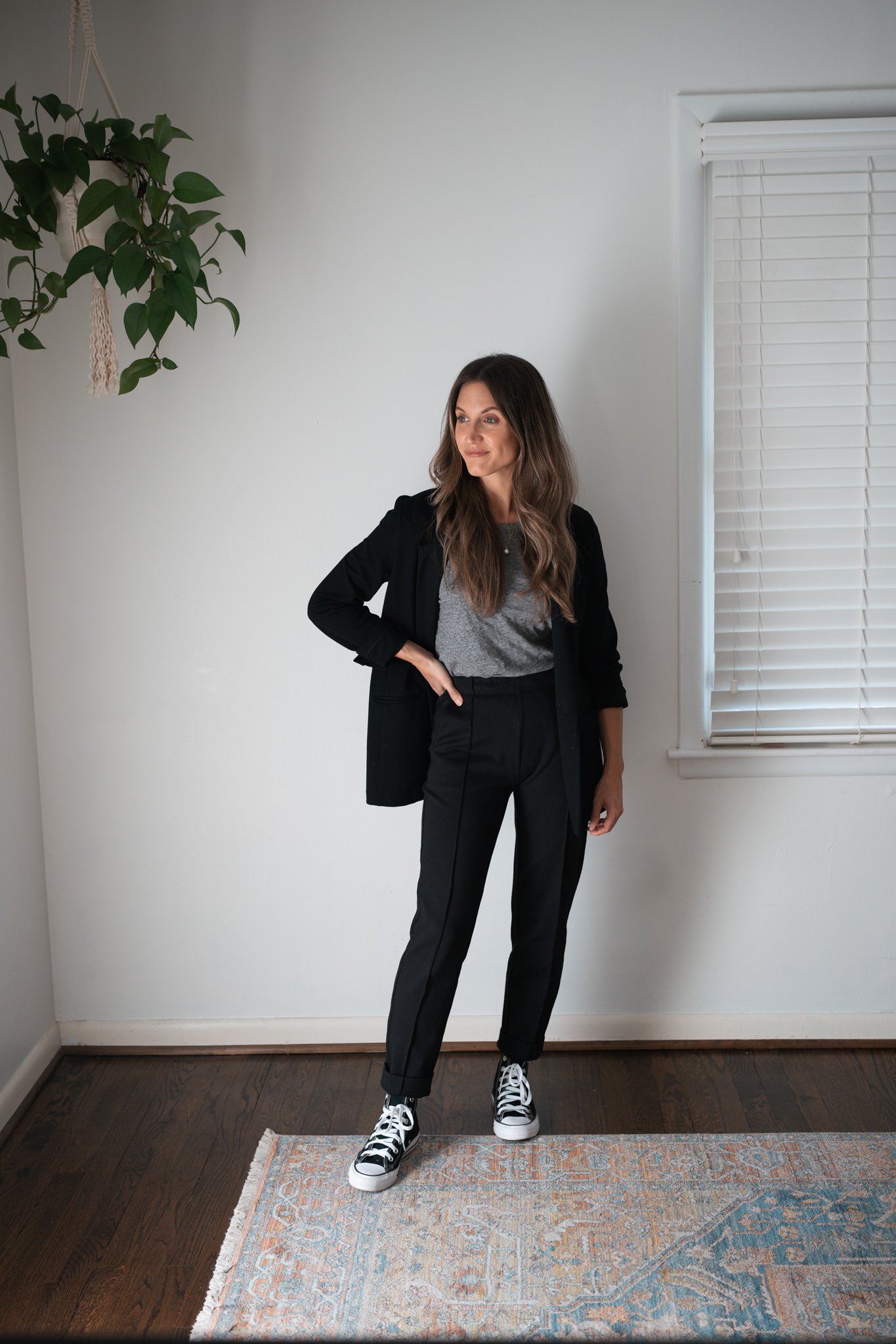 ways to style black pants with a gray tee, black blazer, and high top Converse
