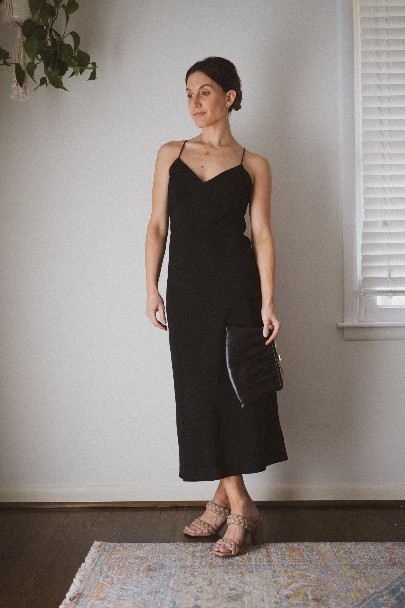 slip dress outfit with heeled sandals and a clutch bag