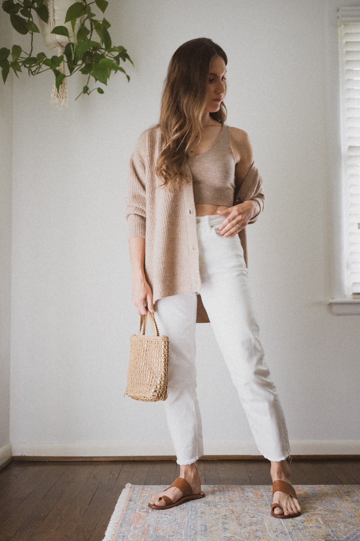 spring outfit with a matching cashmere cropped tank and boyfriend cardigan, white denim, and cognac leather toe ring sandals