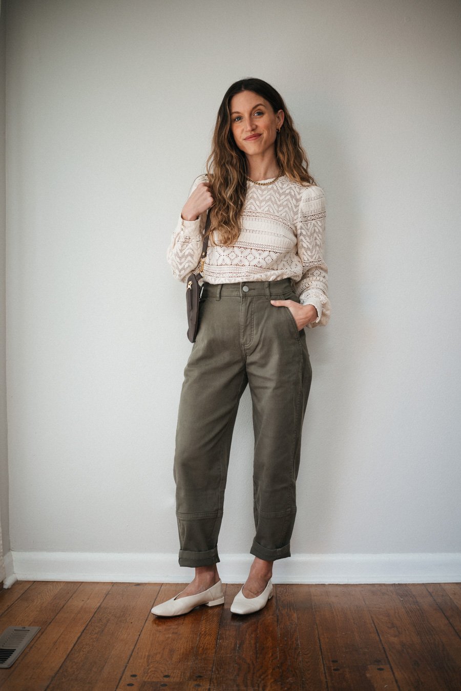 spring outfit with green patns, a white louse, white ballet flats, and a brown bag