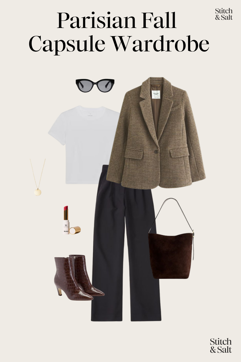 Parisian fall outfit with a white tee, herringbone blazer, black wide leg trousers, brown heeled ankle boots, and a brown suede bucket bag